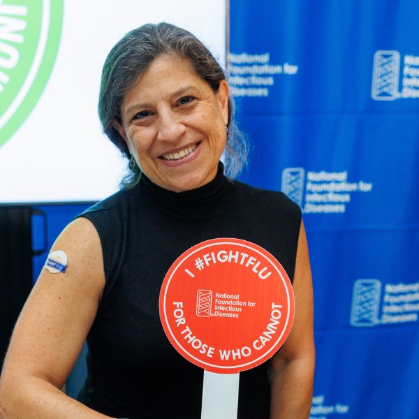 NFID Director Flor M. Muñoz, MD, MSc receives an influenza vaccination at 2024 NFID Annual News Conference
