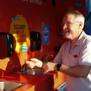 NFID Medical Director Robert H. Hopkins, Jr., MD washing hands at Clean Hands Caravan